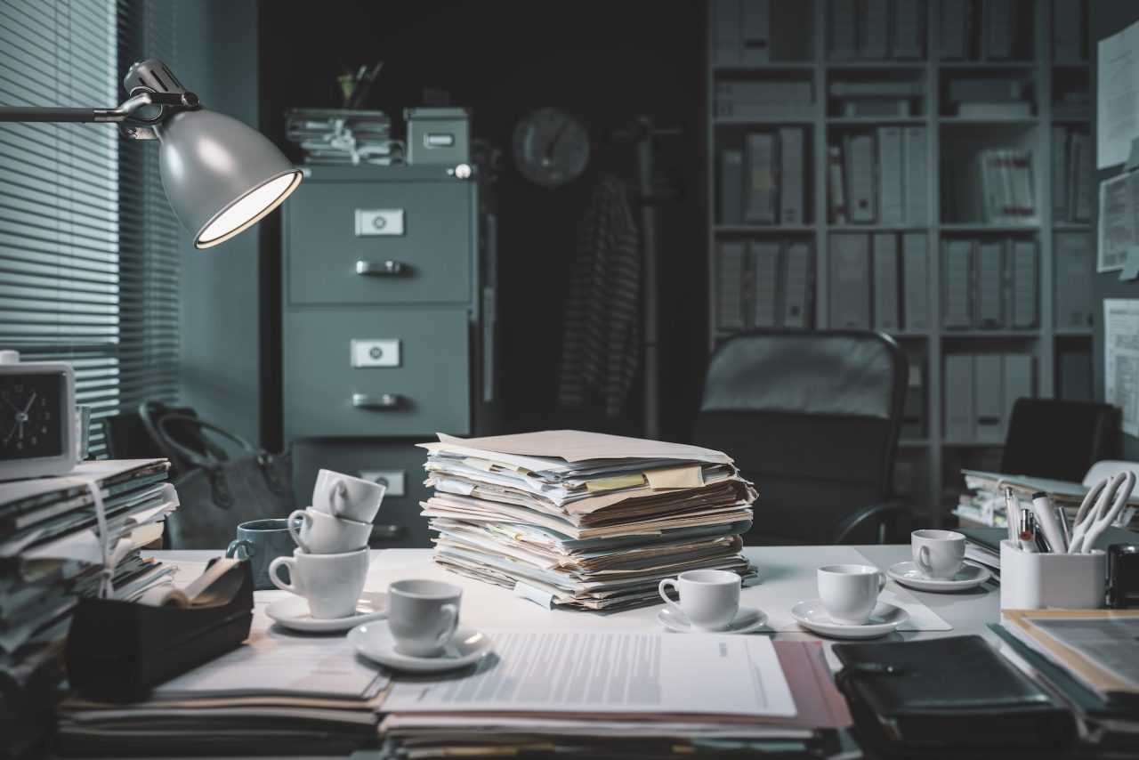 pile-of-paperwork-and-coffee-cups-on-the-office-desk.jpg